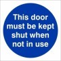 This Door Must Be Kept Shut When Not In Use mandatory door sign with white text on a blue circular background