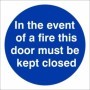 In The Event Of A Fire This Door Must Be Kept Closed mandatory sign with white text on a blue circular background