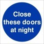 Close These Doors At Night mandatory sign with white text on a blue circular background